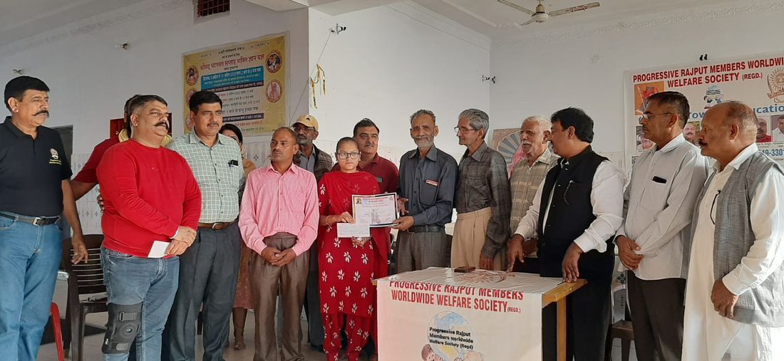 Members with families at a programme