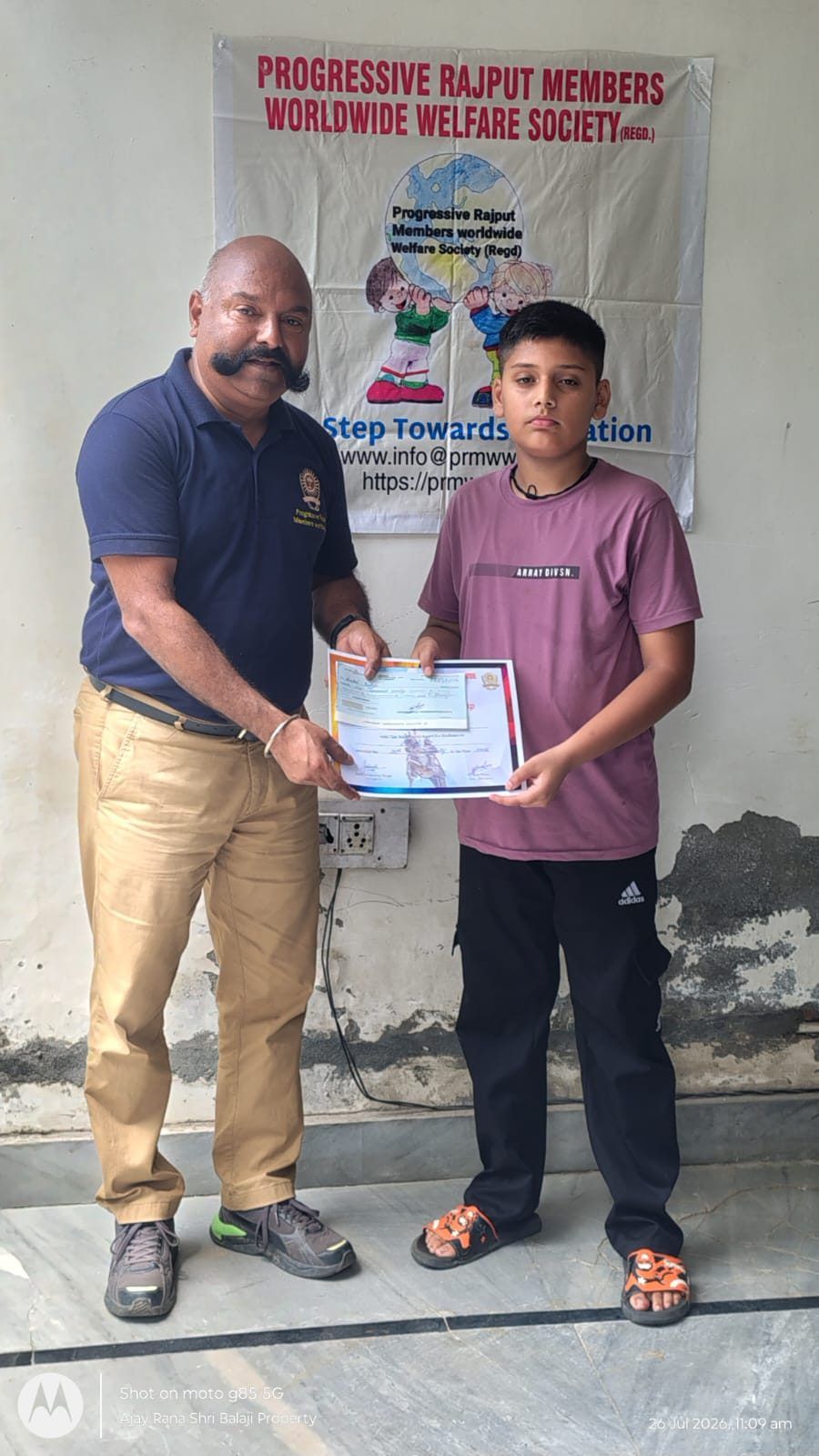 A student with his scholarship certificate